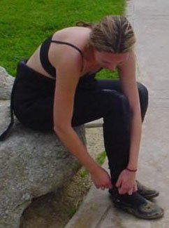 diver putting a wetsuit on